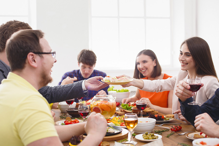 Group of employees have fun at a dinner party.