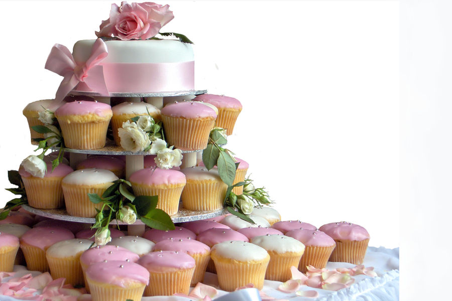 A stack of cupcakes for a wedding cake.